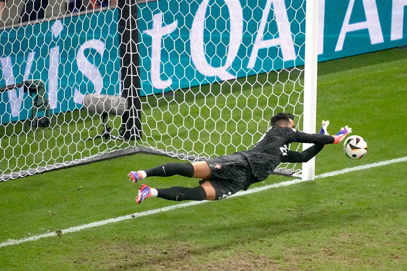 Portugals goalkeeper Diogo Costa saves the ball